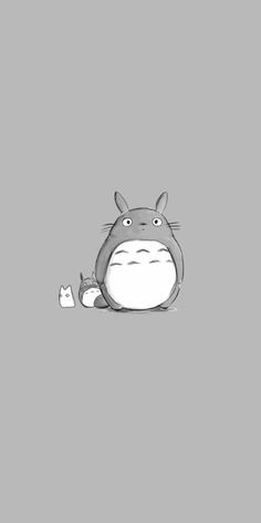 a totoro sitting in the middle of a gray background