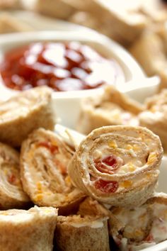 some food is sitting on a plate with dipping sauce