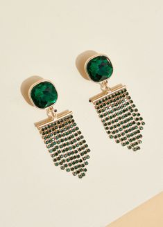 Emerald-colored crystals are ready to set your party look off with gilded fringe dangling from these earrings to add the necessary fun for an unforgettable night! Gold Crystal Tassel Earrings For Evening, Party Tassel Drop Earrings With Rhinestone Fringe, Party Dangle Crystal Earrings With Rhinestone Fringe, Glamorous Rhinestone Fringe Tassel Earrings For Party, Gold Chandelier Earrings With Rhinestone Fringe For Party, Glamorous Party Crystal Earrings With Rhinestone Fringe, Glamorous Tassel Earrings For Party, Glamorous Fringe Earrings For Evenings, Trendy Dangle Chandelier Earrings For Party