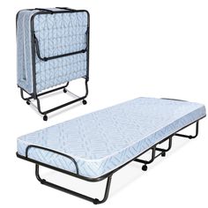 two folding beds with mattresses on them, one in blue and the other in white