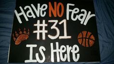 there is a sign that says have no fear it's here with basketballs on it