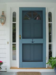 a blue front door with two potted plants on the side and one planter