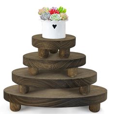 three tiered wooden planter with succulents on each side and a white flower pot in the middle