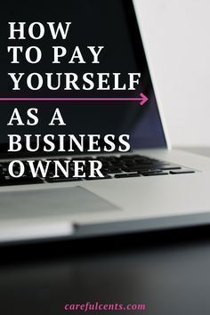 a laptop computer sitting on top of a desk with the words how to pay yourself as a business owner