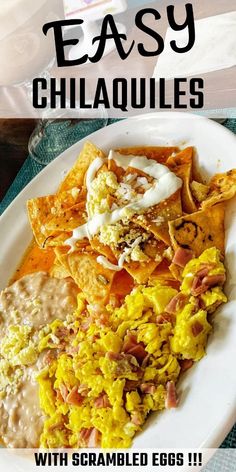 a plate with nachos, eggs and cheese on it