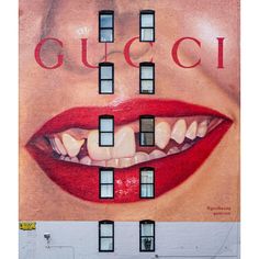 a large advertisement on the side of a building with an image of a woman's mouth