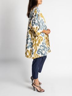 Our chic, oversized Florsana jacket was inspired by the caftan garments of Uzbek royalty and was designed with luxury and beauty in mind. This versatile piece is meant to be worn in place of a blazer and is perfect for travel. Shawl collar and shawl lapel Oversized fit flattering to all sizes 100% silk ikat fabric handwoven in Tashkent, Uzbekistan Tailored in Istanbul, Turkey Dry clean only One size fits most Model is 5'7" and wears size 4. Oversized Tunic Kaftan For Fall, Oversized Fall Tunic Kaftan, Tashkent Uzbekistan, Silk Ikat, Ikat Fabric, Oversized Jacket, Istanbul Turkey, Shawl Collar, Oversized Fits