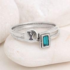 "Made of hammered sterling silver and a Swarovski crystal birthstone, this will be a meaningful statement of those you love ~ always around your finger! This listing is for a set of two rings. One stackable birthstone ring and one stackable Initial/symbol ring. Need more in your stack? Create your own combo here: https://www.etsy.com/listing/230740149 Also available in Gold: https://www.etsy.com/listing/250020772 ♥♥ HOW TO ORDER ♥♥ 1. CHOOSE YOUR SIZE & COMBINATION IN THE DROP DOWNS. 2. IN T Sterling Silver Stackable Rings, May Birthstone Gift, Sterling Silver Nickel-free Birthstone Ring For Gift, Nickel-free Sterling Silver Birthstone Ring For Gift, Sterling Silver Stackable Rings For Anniversary, May Birthstone, Silver Stackable Rings With May Birthstone, Sterling Silver Stackable Rings For Anniversary - May Birthstone, Silver Stackable Rings For May Birthstone, Sterling Silver Birthstone Ring For May, Adjustable Silver Birthstone Ring For May