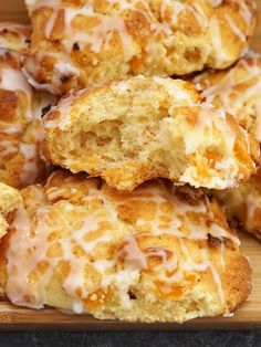 glazed donuts with icing on a cutting board ready to be eaten or eaten