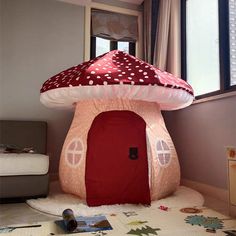 a mushroom shaped house is on the floor