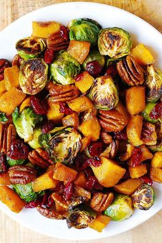 brussel sprouts and brussels sprouts with pecans in a white bowl