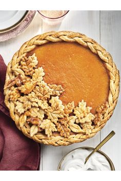 a pumpkin pie with walnuts on top