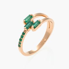 "14K rose gold emerald ring,Emerald engagement ring,emerald baguettes gold ring,modern emerald engagement ring . This particular ring is ready to ship (and any other variations of this ring could be custom made with any gemstones of your choice) A bold yet very elegant design this ring features 3 sparkling and impressive 4x2mm baguette cut emeralds flanked on one of the side by of the ring, total of five round emeralds set along one of the shoulder.  This ring will make a beautiful engagement ri Modern Emerald-cut Green Diamond Ring, Green Emerald Ring With Baguette Diamonds, Luxury 14k Gold Emerald Ring With Baguette Diamonds, Green Emerald Ring With Baguette Diamonds For May Birthstone, May Birthstone Emerald Ring With Baguette Diamonds, May Birthstone Baguette Cut Diamond Rings, Green Emerald Cut Emerald Ring With Baguette Diamonds, Modern Emerald Rings With Baguette Cut, Emerald Cut Emerald Ring With Baguette Diamonds