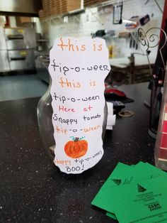 a sign that is on top of a counter next to some papers and scissors in a kitchen