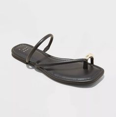 Chic black toe ring sandal with Gold Hardware detail! Toe Ring Sandals