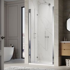 a bathroom with a walk in shower next to a white sink and mirror on the wall