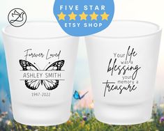 two personalized shot glasses on the grass