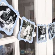 an old photo is hanging on a clothes line in front of a window with pictures