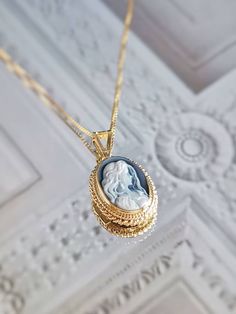 "Featuring a blue agate cameo necklace framed with a golden silver sterling 925 textured frame and chain. ✨ design: Charming white young lady surrounded by long loose hair on a blue background. Shape: Oval. Very charming and elegant, the perfect gift any woman would like to receive. Silver sterling 925 *available also with a silver frame. View \"Cameo Necklaces\" section in shop! ➳Agate is a variety of banded Chalcedony, which is a variety of the mineral Quartz, known for helping you express you Cameo Oval Pendant Necklace For Gift, Elegant Oval Cameo Locket Necklace, Blue Cameo Jewelry For Formal Occasions, Victorian Cameo Locket Necklace As A Gift, Formal Blue Cameo Jewelry, Cameo Round Pendant Necklace For Gift, Cameo Round Pendant Necklace Gift, Blue Cameo Necklace For Wedding, Blue Cameo Jewelry Gift