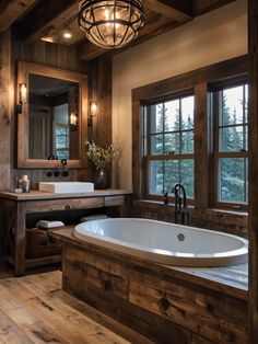 a large bath tub sitting next to a window in a bathroom under a chandelier