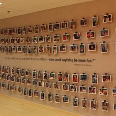 a wall with many pictures hanging on it's sides and some words written in the middle