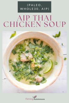 a white bowl filled with chicken soup and garnished with cilantro leaves