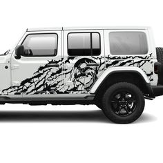 a white jeep with an eagle on it's side and black rims is shown