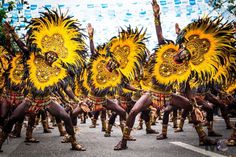 a group of people that are standing in the street with some kind of costume on