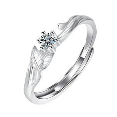 a white gold ring with a diamond in the center and two leaves on each side