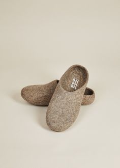 • If you are between sizes, we suggest sizing up• Felted wool slippers• Grippy, sustainable silicone indoor sole• Hassel-free low back for easy slipping on and off• Handmade in Kyrgyzstan For a more narrow fit, we suggest this style. Also available in women's sizes. Kyrgies Classics are handcrafted in Kyrgyzstan by women artisans using a traditional felting technique that is centuries old. The cozy, sustainably felted wool makes this pair of house shoes the ultimate hygge accessory for any seaso Felted Wool Slippers, Handwritten Gifts, Wall Decor Storage, Wool Slippers, Vegan Gifts, Quick Gifts, Cozy Gift, House Shoes, Backpack Travel Bag