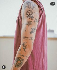 a man with tattoos on his arm and shoulder