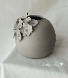 there is a vase with flowers in it