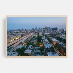 an aerial view of a city at dusk