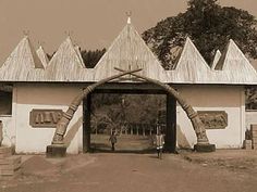 an old black and white photo of the entrance to a building that has crosses on it