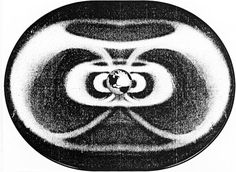 a black and white photo of a circular object with circles in the center, on a white background