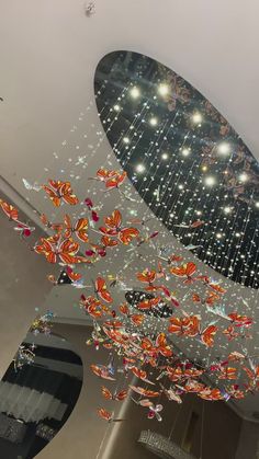 the ceiling is decorated with many different colored glass objects hanging from it's sides