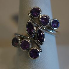 Nwt Sterling Silver (.925) Ring With 8 Bezel Set Genuine Amethysts. Ring Is A Size 9. Sterling Silver Multi-stone Amethyst Ring, Hallmarked Sterling Silver Purple Amethyst Ring, Hallmarked Sterling Silver Amethyst Ring, Hallmarked Purple Amethyst Sterling Silver Ring, Multi-stone Amethyst Ring In Sterling Silver, Silver Multi-stone Amethyst Ring, Purple Sterling Silver Gemstone Ring, Purple Multi-stone Gemstones In Sterling Silver, Purple Gemstone Ring In Sterling Silver