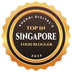 the top in singapore food blogger badge for 2013, with gold seal and black background