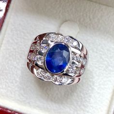 BRAND-NEW!! ONE OF A KIND, HANDCRAFTED RING. EXQUISITE AND FINE CRAFTSMANSHIP! HANDMADE TO LAST FOR AN ETERNITY!! HEIRLOOM PIECE!! PRECIOUS JEWELRY TO BE PASSED ON! PERFECT DRESS RING FOR A GENTLEMAN! 3.42 total carat weight, Certified, Natural blue sapphire ring. This ring offers an important statement of who you are with a 2.37 carats, VIVID BLUE, transparent, CEYLON BLUE SAPPHIRE. Accentuating the BLUE SAPPHIRE are the 20 G/VS, sparkling natural diamonds SUGGESTED RETAIL VALUE: $8,500   BLUE Luxury Handmade Blue Sapphire Ring, Elegant Luxury Sapphire Men's Ring, Luxury Blue Sapphire Ring Hallmarked, Luxury Blue Men's Ring Collectible, Luxury Blue Gemstone Men's Ring, Ceylon Blue Sapphire, White Gold Earrings Studs, Dress Ring, Blue Sapphire Diamond