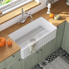 a white sink sitting on top of a kitchen counter next to a wooden countertop