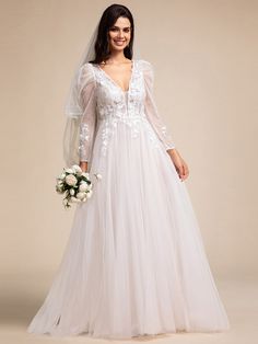 a woman in a white wedding gown with sleeves and flowers on her head is posing for the camera