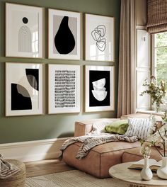 a living room filled with furniture and pictures on the wall above it's coffee table