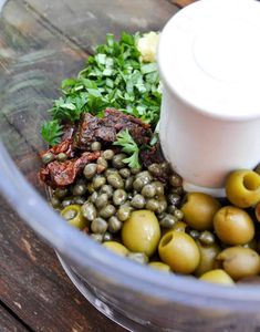 olives and other ingredients in a food processor