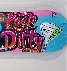 a skateboard with the words keep dirty painted on it