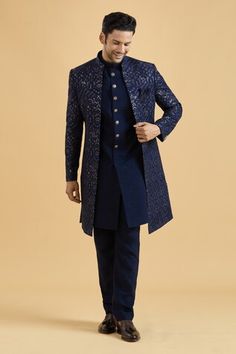 Navy blue sherwani featuring floral thread embroidery all over highlighted with sequin. Paired with a solid kurta and a pant. - Aza Fashions Reception Bandhgala With Zari Work, Diwali Nehru Jacket With Resham Embroidery For Reception, Eid Reception Kurta With Dori Work, Bandhgala Straight Kurta For Diwali Reception, Diwali Reception Bandhgala Straight Kurta, Bandhgala With Resham Embroidery For Reception Navratri, Resham Embroidered Bandhgala For Reception Navratri, Blue Bandhgala For Navratri Designer Wear, Straight Kurta Bandhgala With Dupatta For Reception