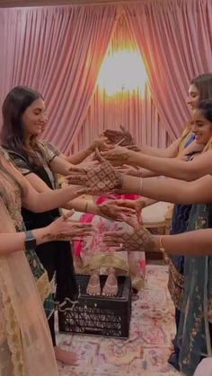 a group of women standing around each other