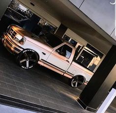 a white truck parked in front of a building