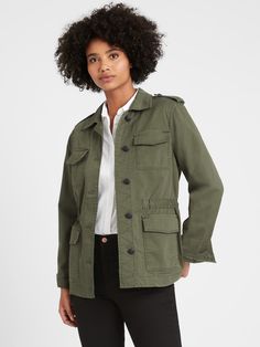 A utility-inspired jacket designed with plenty of pockets to hold all the essentials, lined in a subtle, polka-dot print.  Made in a soft, sturdy stretch-cotton twill for an authentic look and feel.  Point collar.  Chest pockets.  Long sleeves.  Button front closure.  Shoulder epaulets.  Flap front pockets.  Concealed drawstring waist.  Fully lined sleeves.  Half-body lining.  Cut with room through the chest, arms and waist.  Long sleeves.  Hits at the hip.  Center back length (size S): Petite 2 Deep Olive Green, Green Cargo Jacket, Stylish Summer Outfits, Transition Outfits, Cargo Jacket, Create Outfits, Jacket Design, Polka Dot Print, Utility Jacket