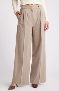 Move from desk days to drinks dates in gracefully draped pants cut from a feel-good fabric. 30" inseam; 24" leg opening; 13" front rise; 16 1/2" back rise (size 8) Zip fly with hook-and-bar closure 62% REPREVE® recycled polyester, 33% rayon, 5% spandex REPREVE recycled polyester is made from 100% post-consumer recycled plastic bottles Machine wash, tumble dry Imported Beige Wide Leg Bottoms For Business Casual, Formal Beige Bottoms For Spring, Spring Wide Leg Pants With Welt Pockets, Relaxed Fit Full Length Office Bottoms, Spring Office Pants Full Length, Spring Classic Full Length Wide Leg Pants, Spring Office Wide Leg Full Length Pants, Relaxed Fit Wide Leg Formal Pants, Formal Relaxed Fit Wide Leg Pants