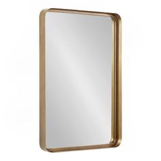 a gold framed mirror on a white wall